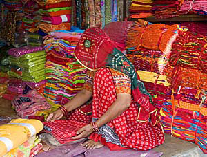 Gus Feissel: Woman in Fabric Store