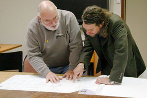 Howard Curtis and David Susalla review plans for the Gualala Arts Center elevator