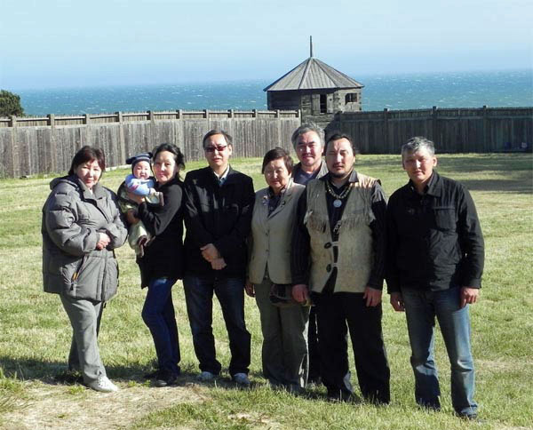 Marina is holding baby with her husband Vasily next to her, Michail Ershov is last person on the right. To his left is Leonid Savvin, shaman, who will also be at event as well