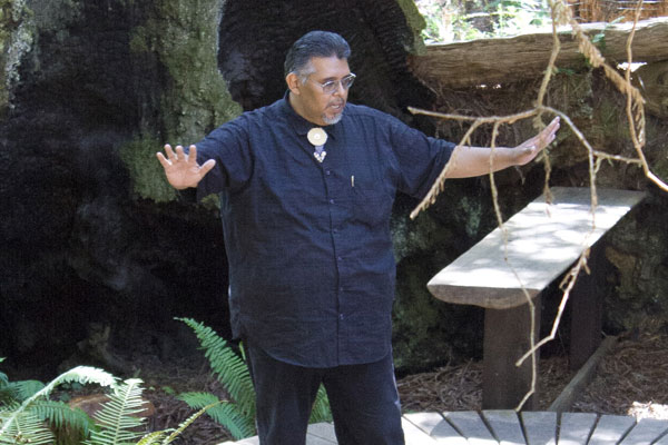 Eric Wilder telling Kashaya history in the redwood grove