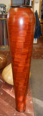 Handcrafted 54-inch tall vase 'Twister' made from exotic African red padouk and wenge woods by Robert Gauthier